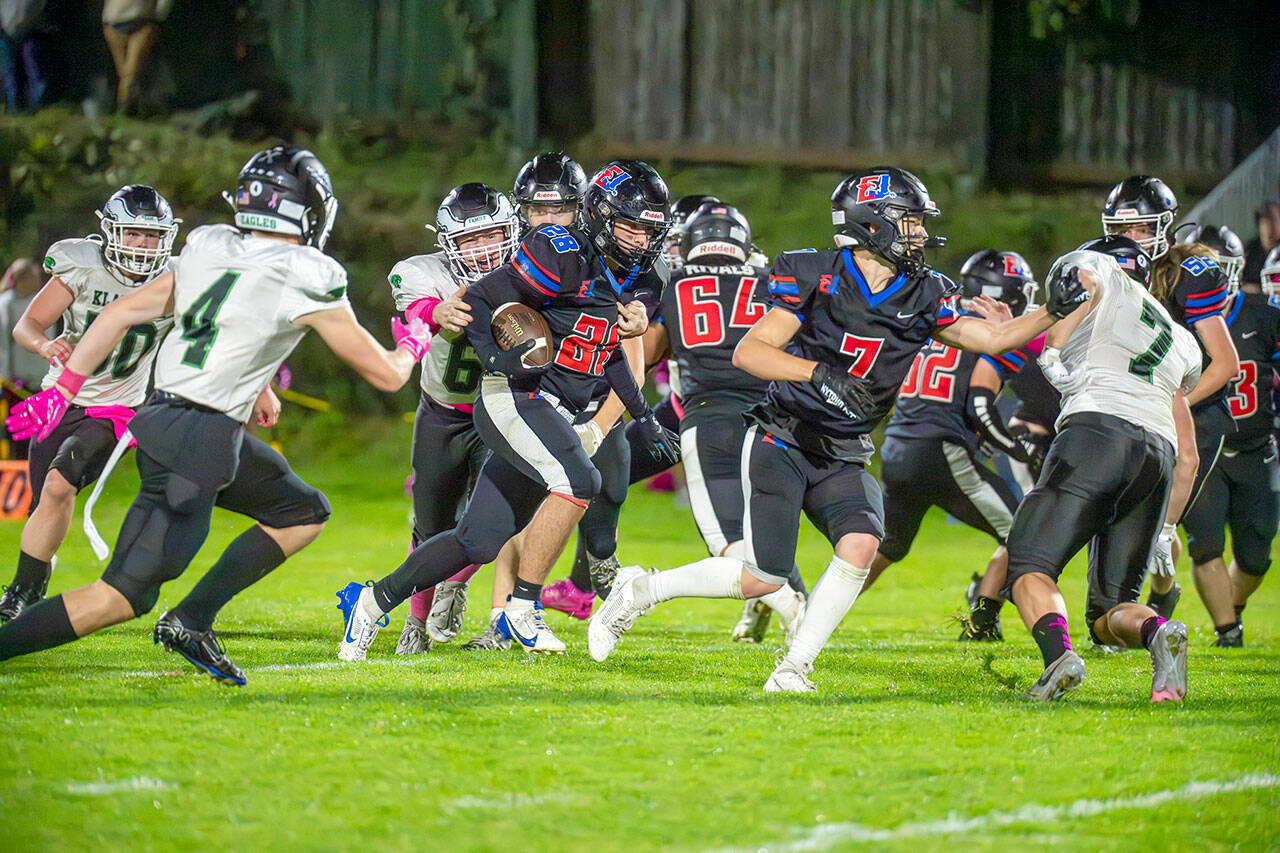 East Jefferson’s Alex Garcia runs with the football while teammate Jackson Dupuy (7) serves as lead blocker during a 2024 contest against Klahowya at Memorial Field in Port Townsend. Both All-Nisqually League players return for the Rivals this fall.
Steve Mullensky/for Peninsula Daily News