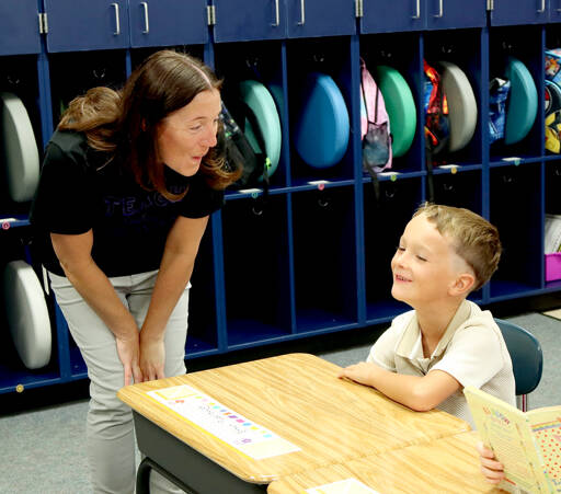Jefferson Elementary School first-grade teacher Pamela Miller welcomes Ethan Puderbaugh to the classroom as school started Tuesday in the Port Angeles School District. Port Townsend and Chimacum schools also began Tuesday while classes in the Quillayute Valley and Cape Flattery school districts start today. The Quilcene and Brinnon school districts began Aug. 25 while Sequim and Crescent schools began Aug. 27. (Dave Logan/for Peninsula Daily News)