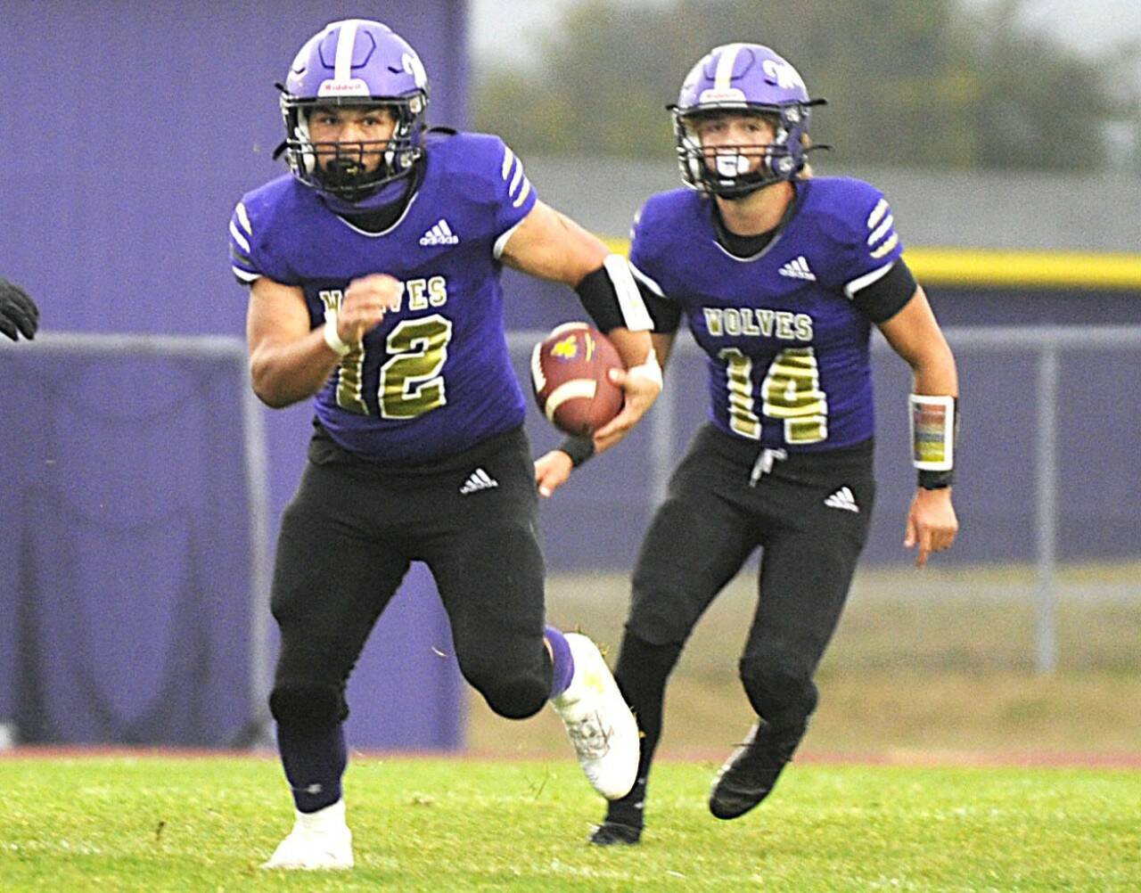 Sequim's LIam Wiker (12) and Zeke Schmadeke (14) look to be a potent one-two punch for the Wolves' offense this season. (Michael Dashiell/Olympic Peninsula News Group)