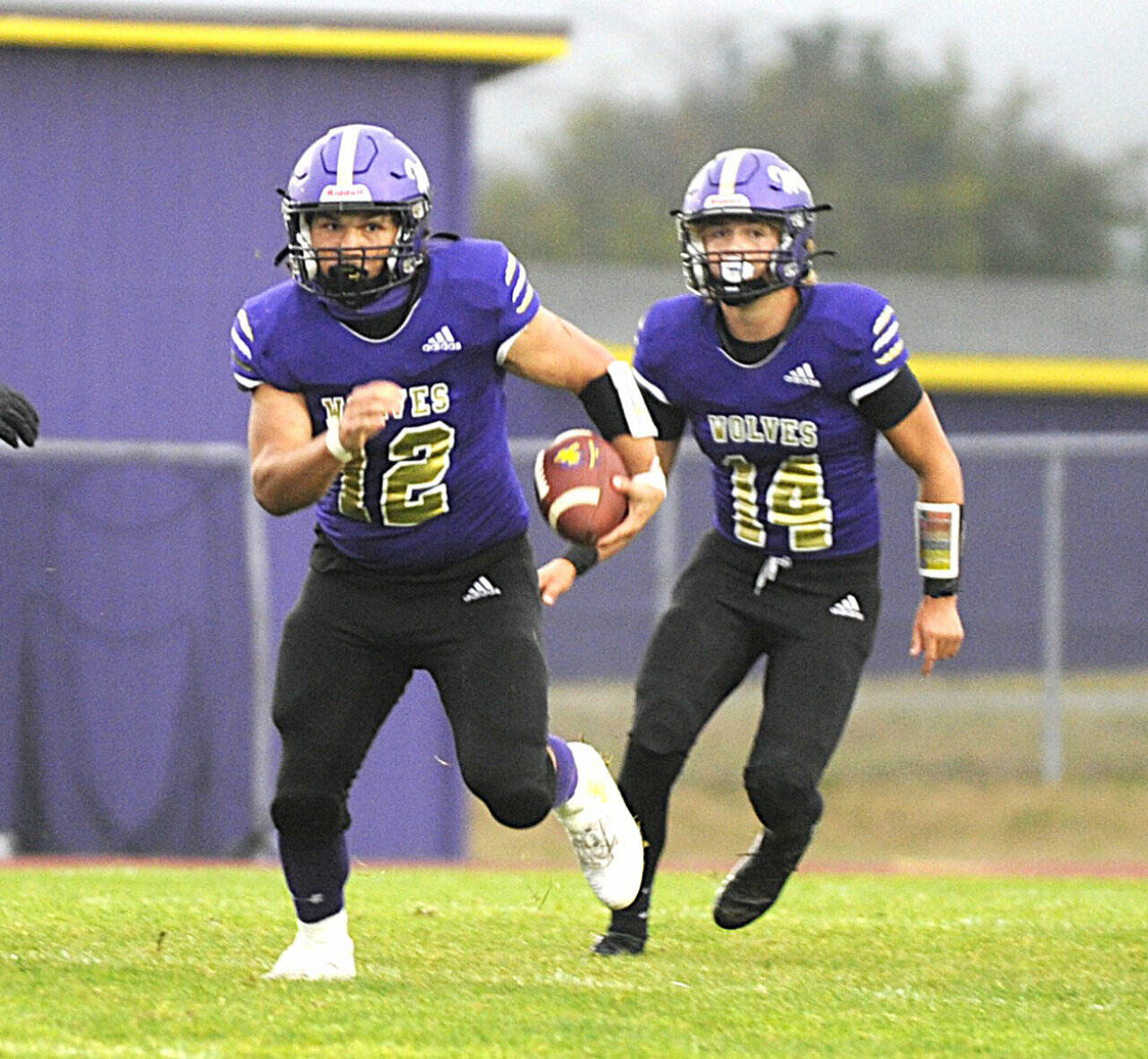 Sequim’s LIam Wiker (12) and Zeke Schmadeke (14) look to be a potent one-two punch for the Wolves’ offense this season. (Michael Dashiell/Olympic Peninsula News Group)