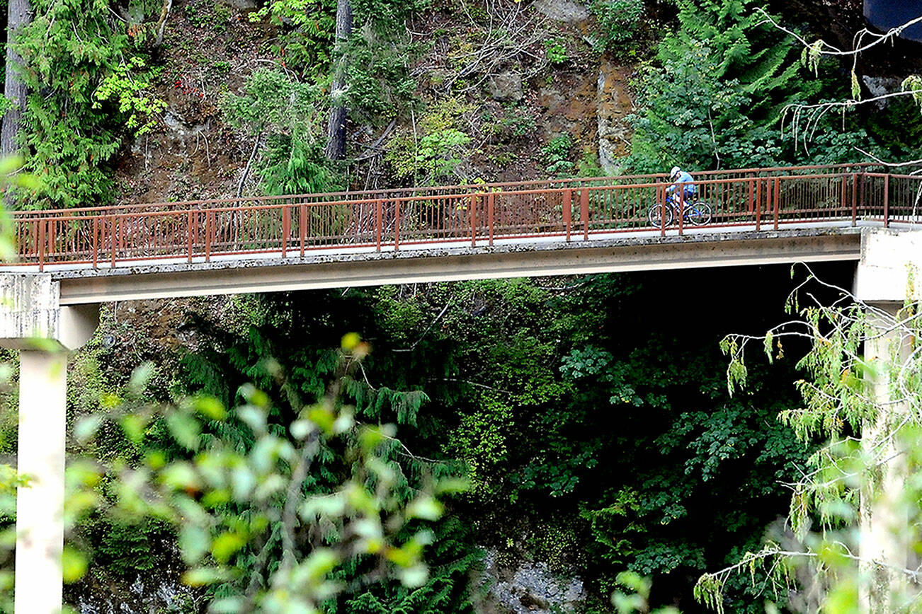 A bicyclist makes his way over an approach span to the pedestrian bridge beneath the Elwha River Bridge west of Port Angeles. The bridges are part of the Olympic Discovery Trail, which, when completed, will stretch from Port Townsend to La Push on the Pacific coast. (Keith Thorpe/Peninsula Daily News)