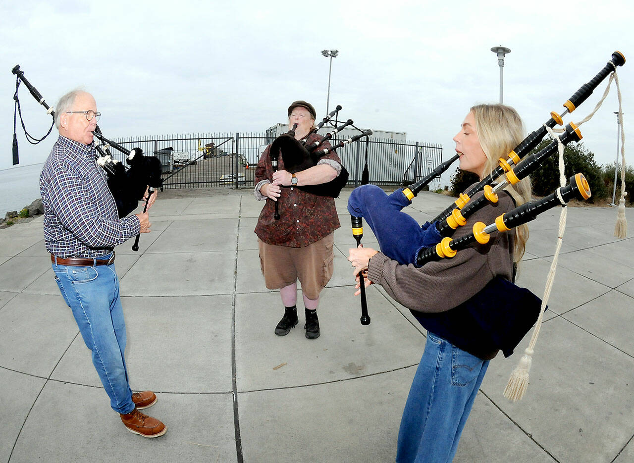 Bagpipers, from left, Tom McCurdy, Erik Evans and Heidi Slack, all of Port Angeles, perform together on Tuesday at Pebble Beach Park in Port Angeles. The trio were practicing songs to be played at 9/11 commemoration ceremonies across the North Olympic Peninsula. (Keith Thorpe/Peninsula Daily News)