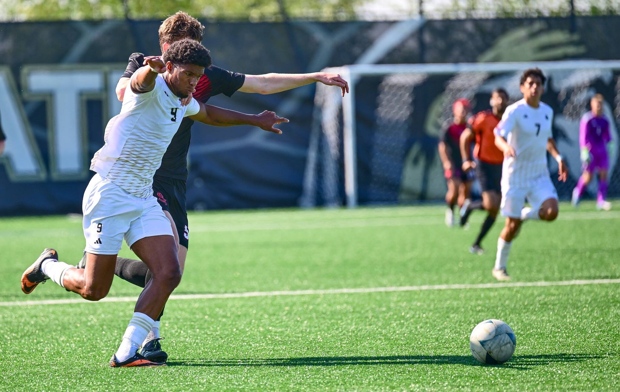 Jay Cline/Peninsula College Athletics
Peninsula College's Jeremy Obah is held at the shoulder and stepped on by Skagit Valley's Robbie Spain during the Pirates' 7-0 win over the Cardinals on Wednesday at Wally Sigmar Field in Port Angeles.