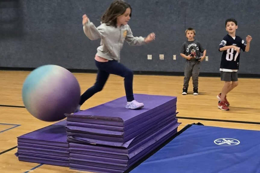 Vera Eksteen masters an obstacle course at the Sequim Boys & Girls Club while Hunter Brown, left, and Rome Martin look on. (Boys & Girls Clubs of the Olympic Peninsula)