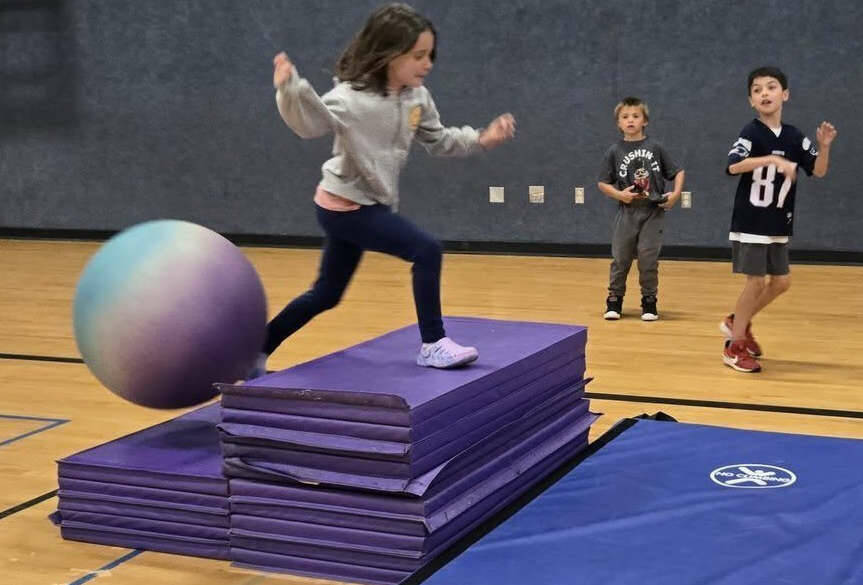 Vera Eksteen masters an obstacle course at the Sequim Boys & Girls Club while Hunter Brown, left, and Rome Martin look on. (Boys & Girls Clubs of the Olympic Peninsula)