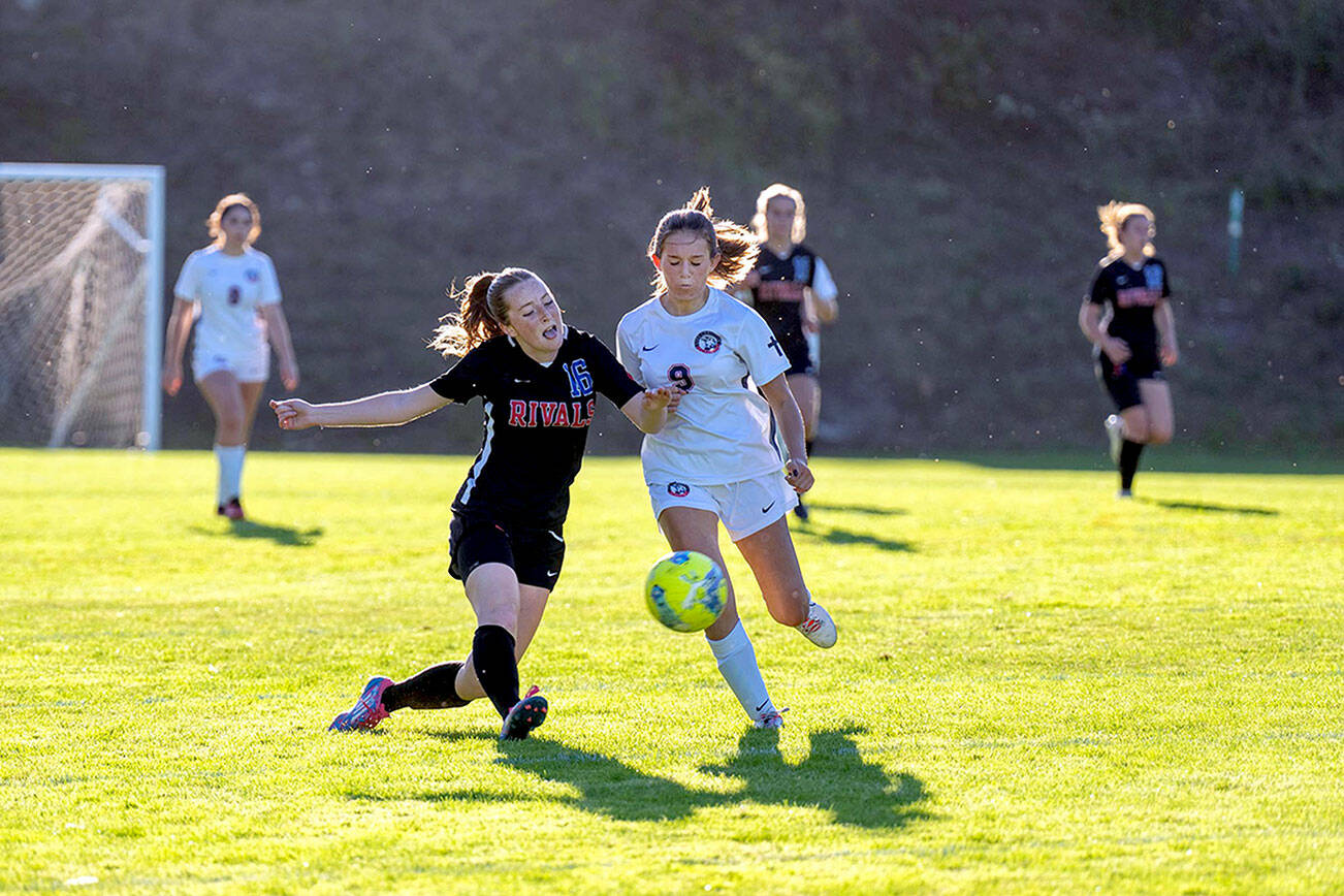 Steve Mullensky/for Peninsula Daily News

Rivals Fern French challenges Life Christian's Lucia Roso for control during the first half of a game played on Thursday at Port Townsend's Memorial Field.
