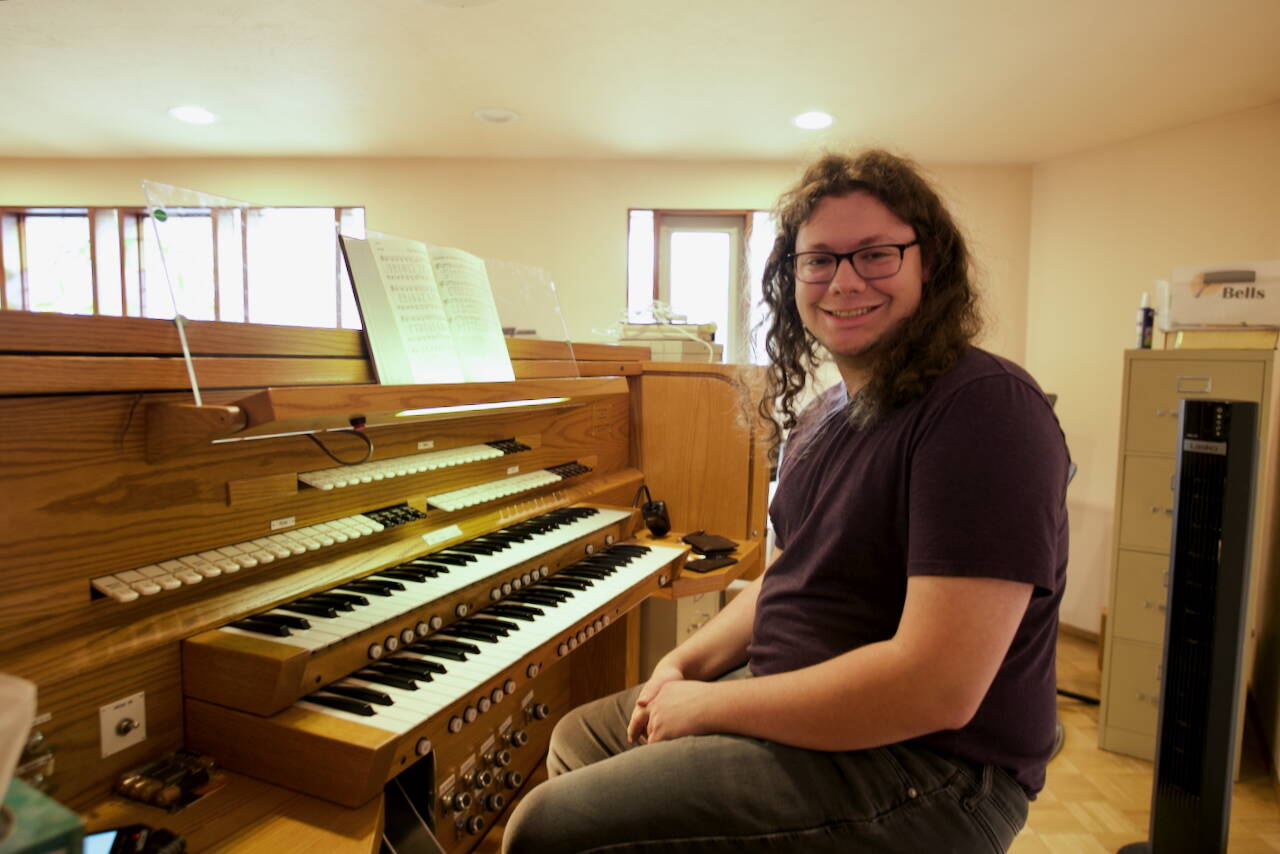 Jacques Star/Olympic Peninsula News Group
Ryan Edinger sits at the organ he now commands at Faith Lutheran Church in Sequim. There are 10 ranks of pipes, each with 61 notes, including flats and sharps.
