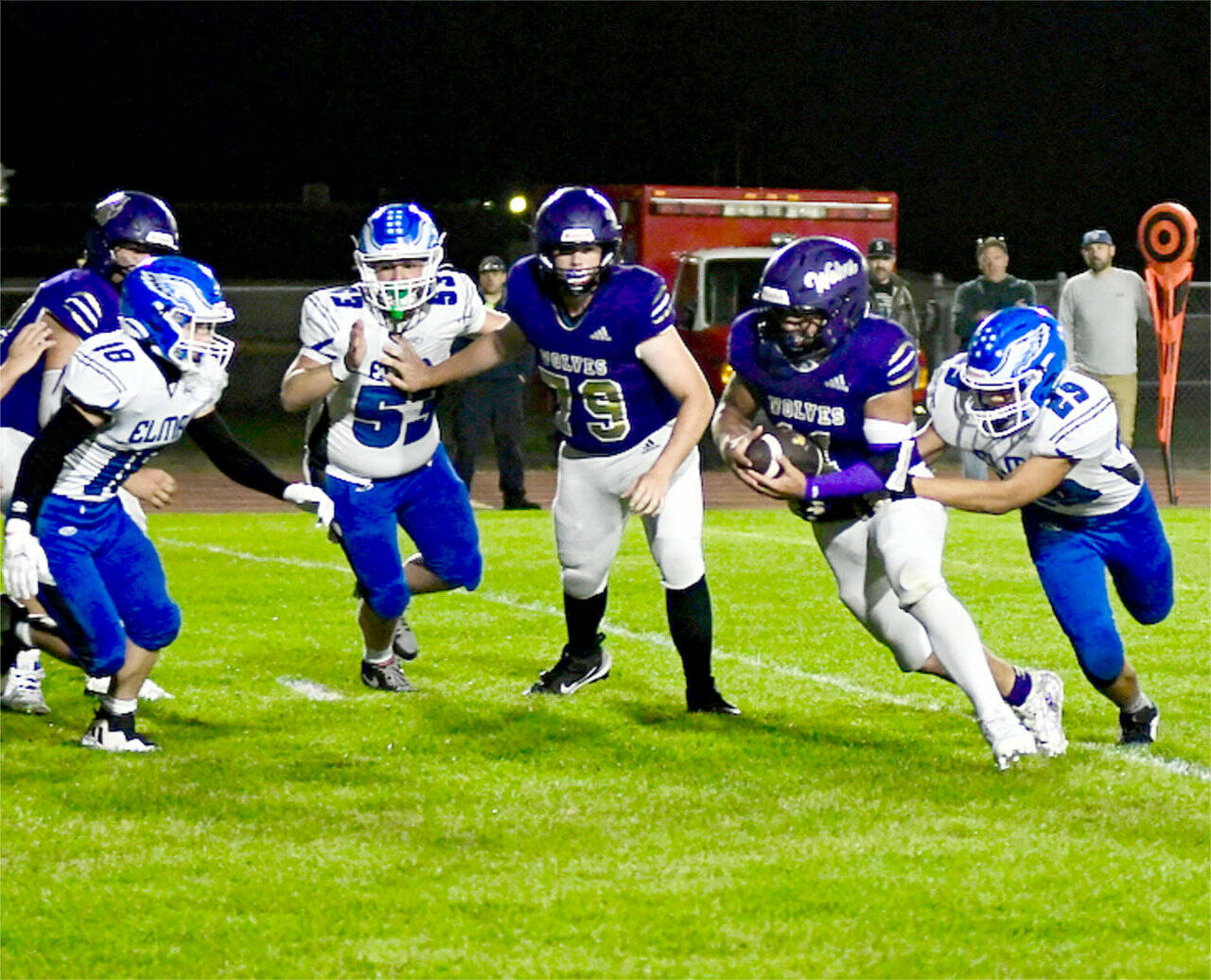 Sequim’s Liam Wiker had two rushing touchdowns and a 41-yard catch and run against Elma on Friday night as the Wolves won 49-30. (Jacques Star/Olympic Peninsula News Group)
