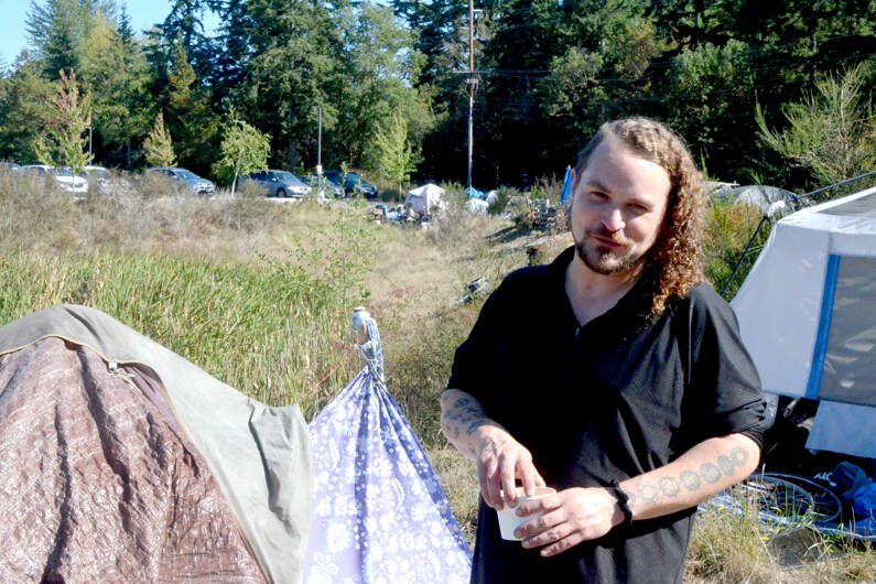 Damian Eldritch, a resident of the encampment located behind the Department of Social and Health Services building in Port Townsend. (Elijah Sussman/Peninsula Daily News)