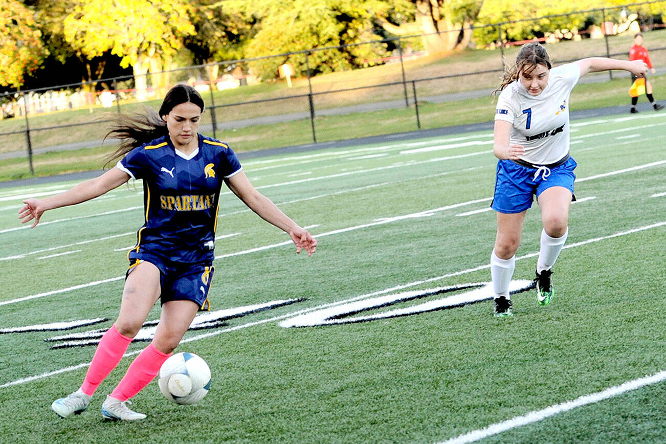 Forks' Jade Blair controls the ball against Toutle Lake at Spartan Stadium on Wednesday. 
Lonnie Archibald/for Peninsula Daily News