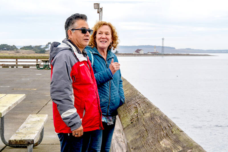 Saul and Suzanna Martinez of Monroe take in the view over the Salish Sea from Fort Worden State Park on Thursday. The couple enjoyed a quick trip to Port Townsend to celebrate their 37th wedding anniversary. (Steve Mullensky/for Peninsula Daily News)