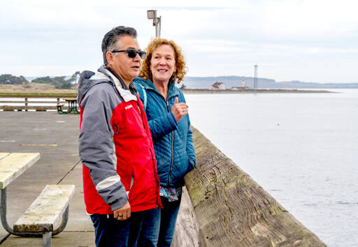 Saul and Suzanna Martinez of Monroe take in the view over the Salish Sea from Fort Worden State Park on Thursday. The couple enjoyed a quick trip to Port Townsend to celebrate their 37th wedding anniversary. (Steve Mullensky/for Peninsula Daily News)