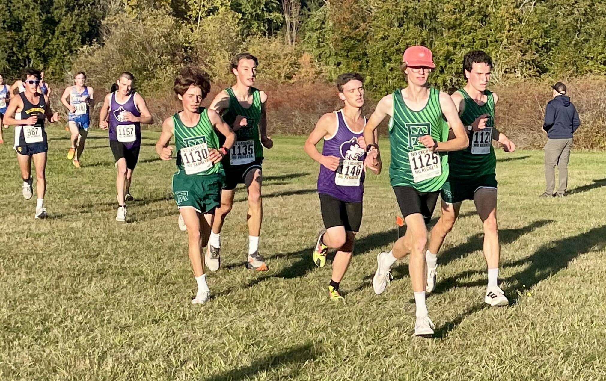 Port Angeles Cross Country 
Port Angeles’ top boys runners, Easton Dempsey in the pink hat and Andre Campbell, pace teammates Henry Wendel and Jay Lieberman during an Olympic League cross country race at Battle Point Park in Bainbridge.