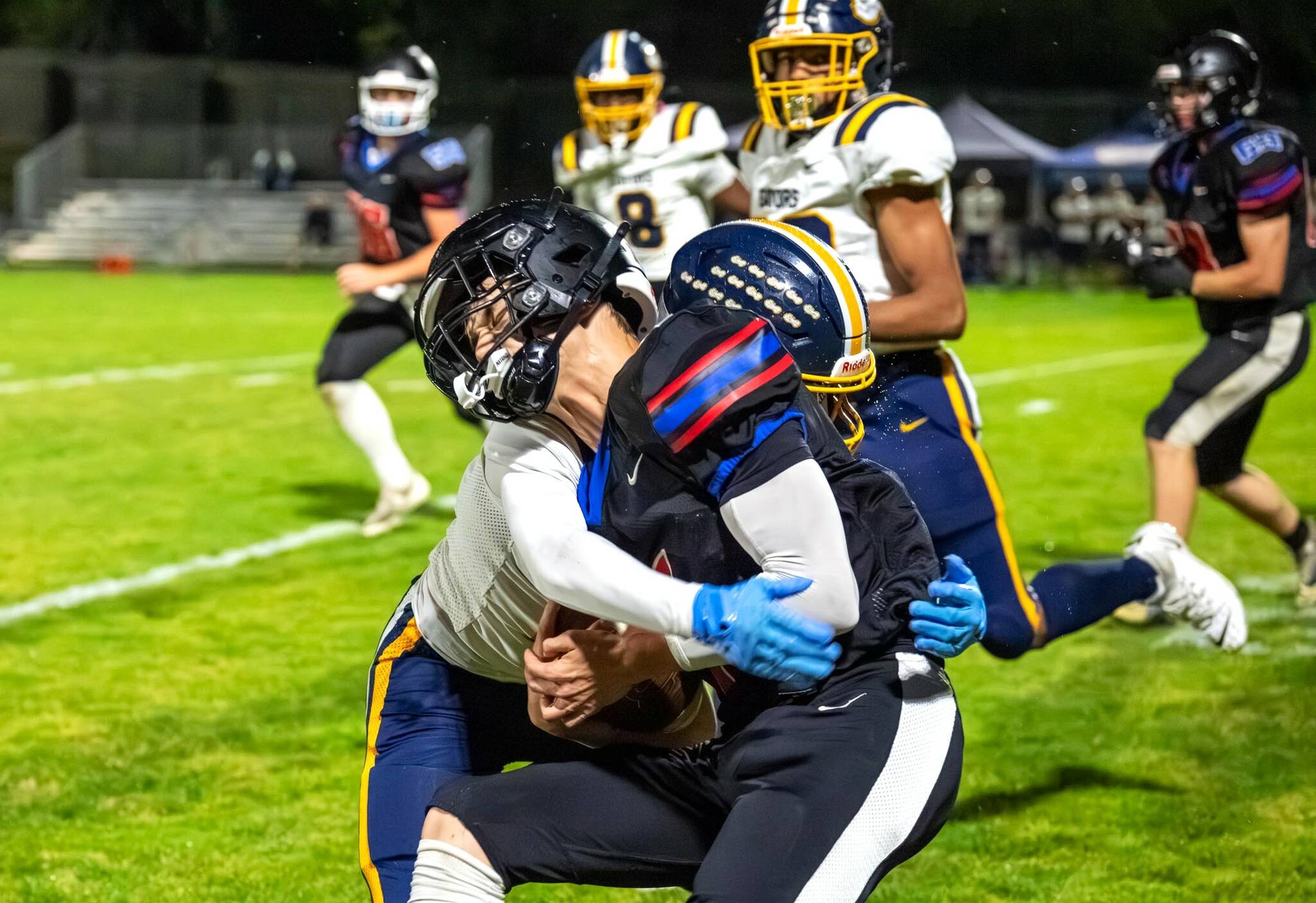 East Jefferson’s Jackson Dupuy is tackled against Annie Wright last week. Dupuy gained 154 yards rushing Friday night against Bellevue Christian to help the Rivals beat the vikings 33-7. (Steve Mullensky/for Peninsula Daily News)