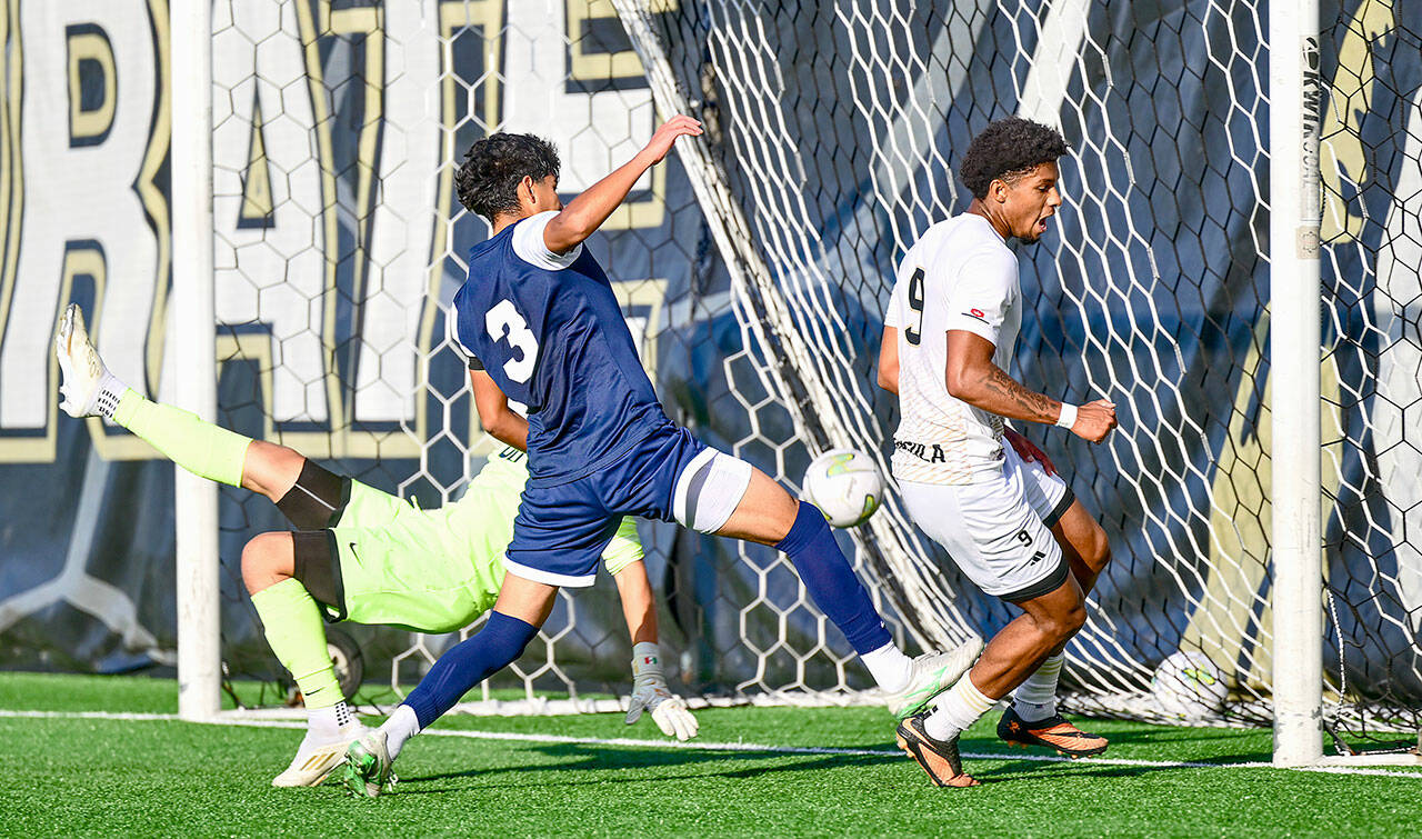 Jay Cline/Peninsula College Athletics Peninsula’s Jeremy Obah, right, scores the eventual game-winning goal in the 81st minute of Wednesday’s 1-0 win over Bellevue at Wally Sigmar Field. The Pirate men clinched the NWAC North Region title and a first-round playoff bye with the victory.