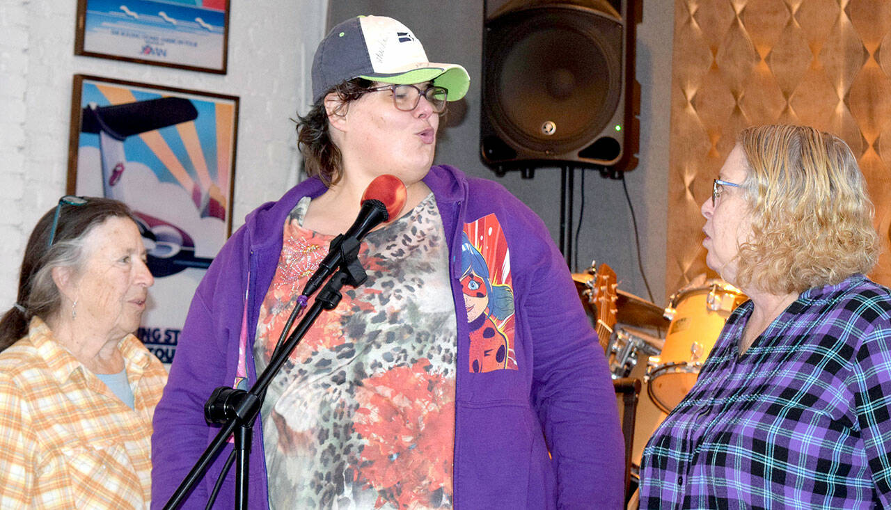 Bonny Cates, portraying Big Mama Thornton, sings during rehearsal flanked by Boneita Smith and Patty Davis.