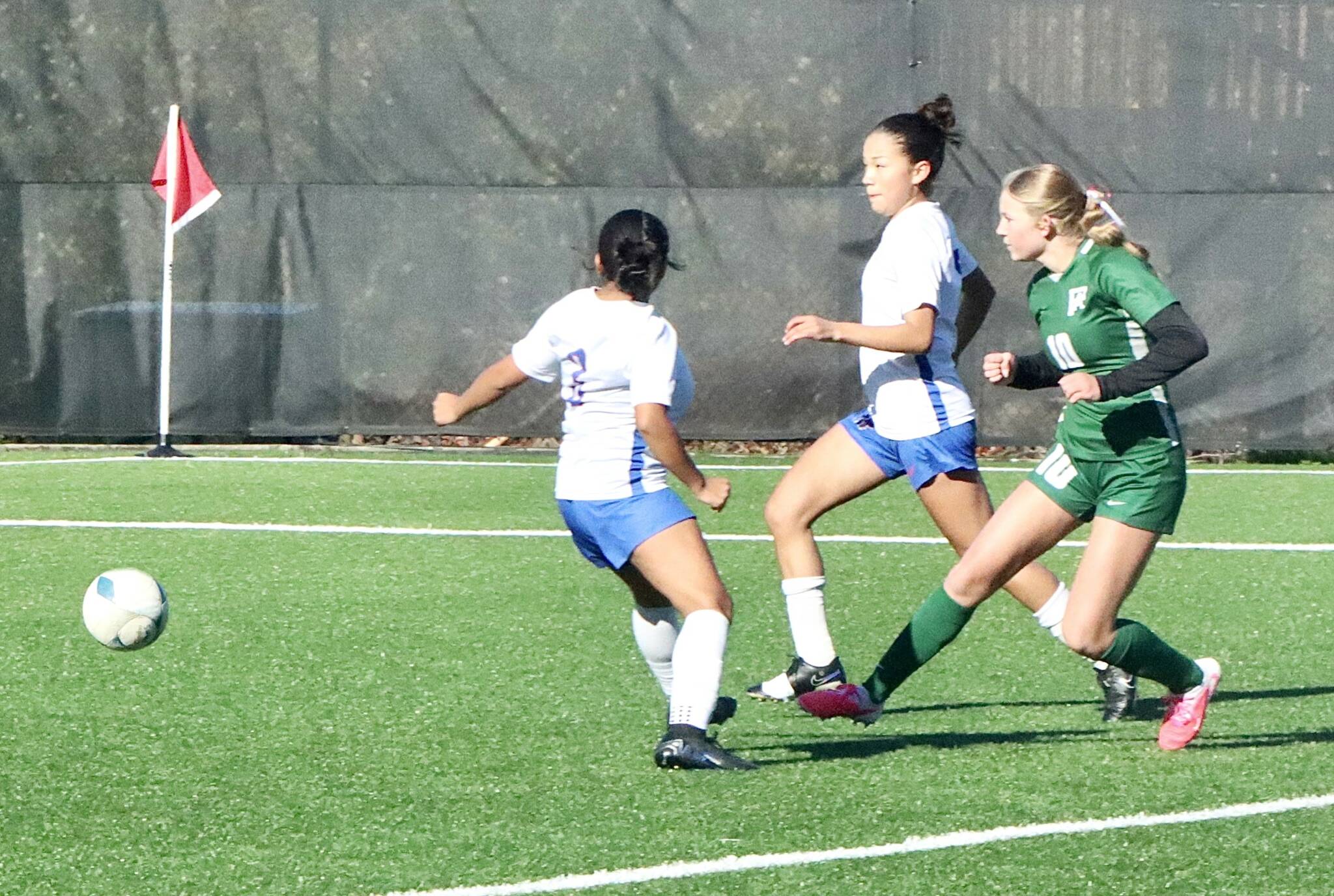 Port Angeles’ Lilly Anne Lancaster scores one of her three goals against Washington on Saturday at Wally Sigmar Field at Peninsula College. (Dave Logan/for Peninsula Daily News)