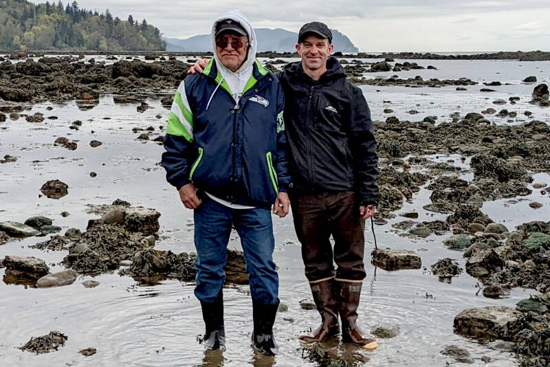 “My Heart Is Good” co-authors Ron Charles, left, and Josh Wisniewski, on the shore west of Port Angeles near Deep Creek, will discuss their new book at three public events. (Empty Bowl Press)
