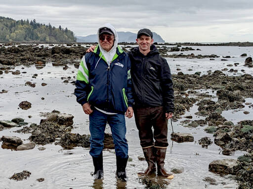 “My Heart Is Good” co-authors Ron Charles, left, and Josh Wisniewski, on the shore west of Port Angeles near Deep Creek, will discuss their new book at three public events. (Empty Bowl Press)
