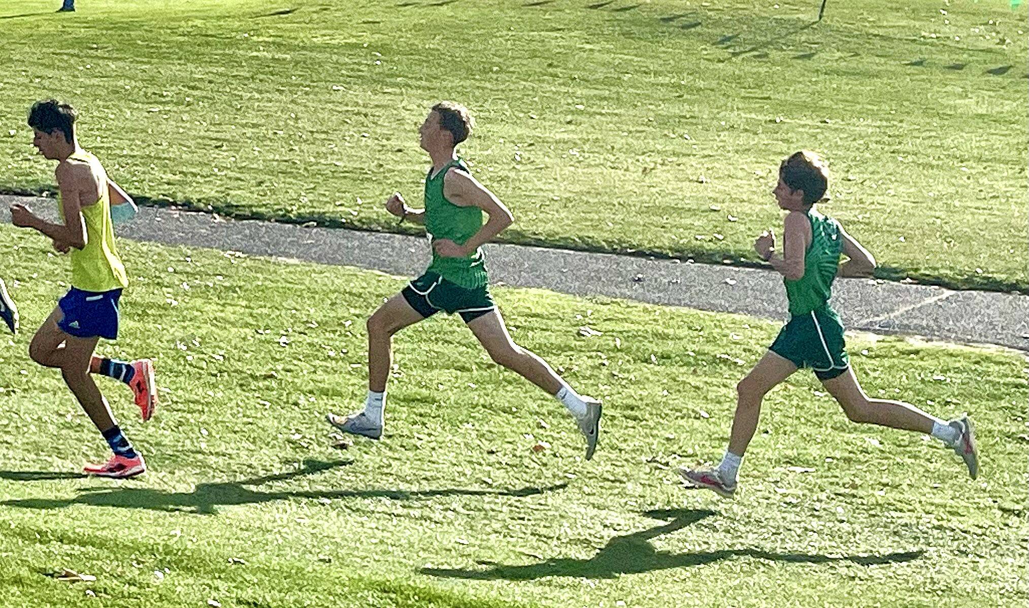 Port Angeles’ Henry Wendel and Jay Lieberman in the state 2A cross-country race at Sun Willows Golf Course in Pasco. (Angie Gooding)