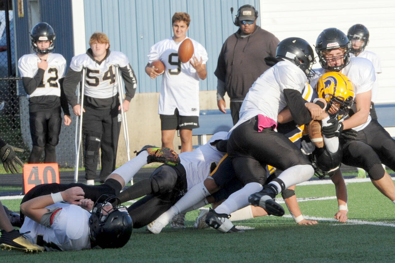 Lonnie Archibald/for Peninsula Daily News
Forks' Estevan Ramos (yellow helmet) is tackled during a 2024 game against Meridian. Ramos made the All Central 2B League, Western Division second team as both a kick return specialist and as a wide receiver.