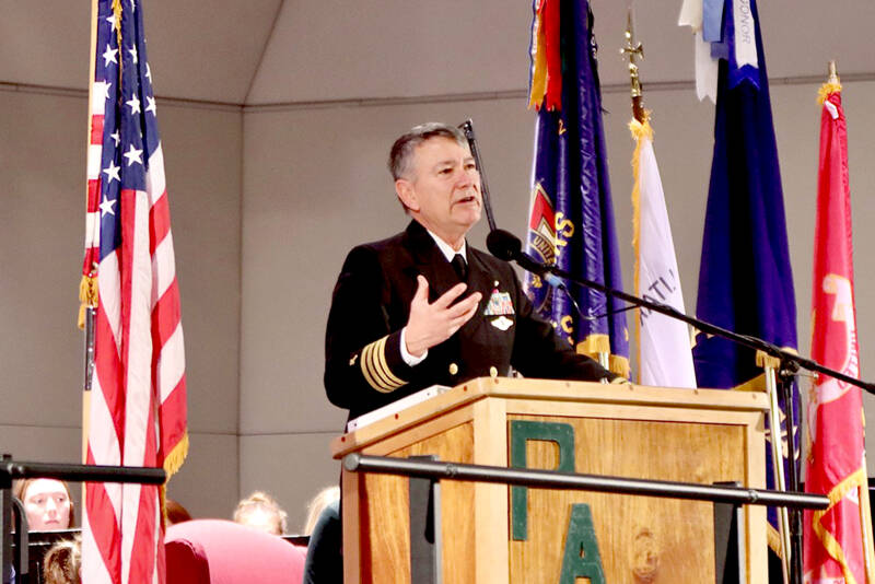 Retired Capt. John Hakanson of the U.S. Navy Chaplain Corps speaks about his military experience on Tuesday during a Veterans Day ceremony at the Port Angeles High School auditorium. (Dave Logan/for Peninsula Daily News)