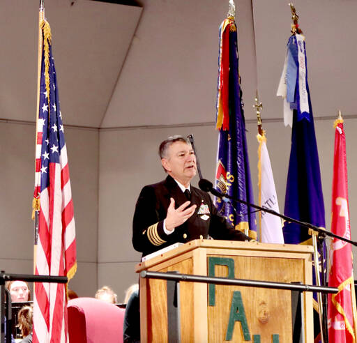 Retired Capt. John Hakanson of the U.S. Navy Chaplain Corps speaks about his military experience on Tuesday during a Veterans Day ceremony at the Port Angeles High School auditorium. (Dave Logan/for Peninsula Daily News)