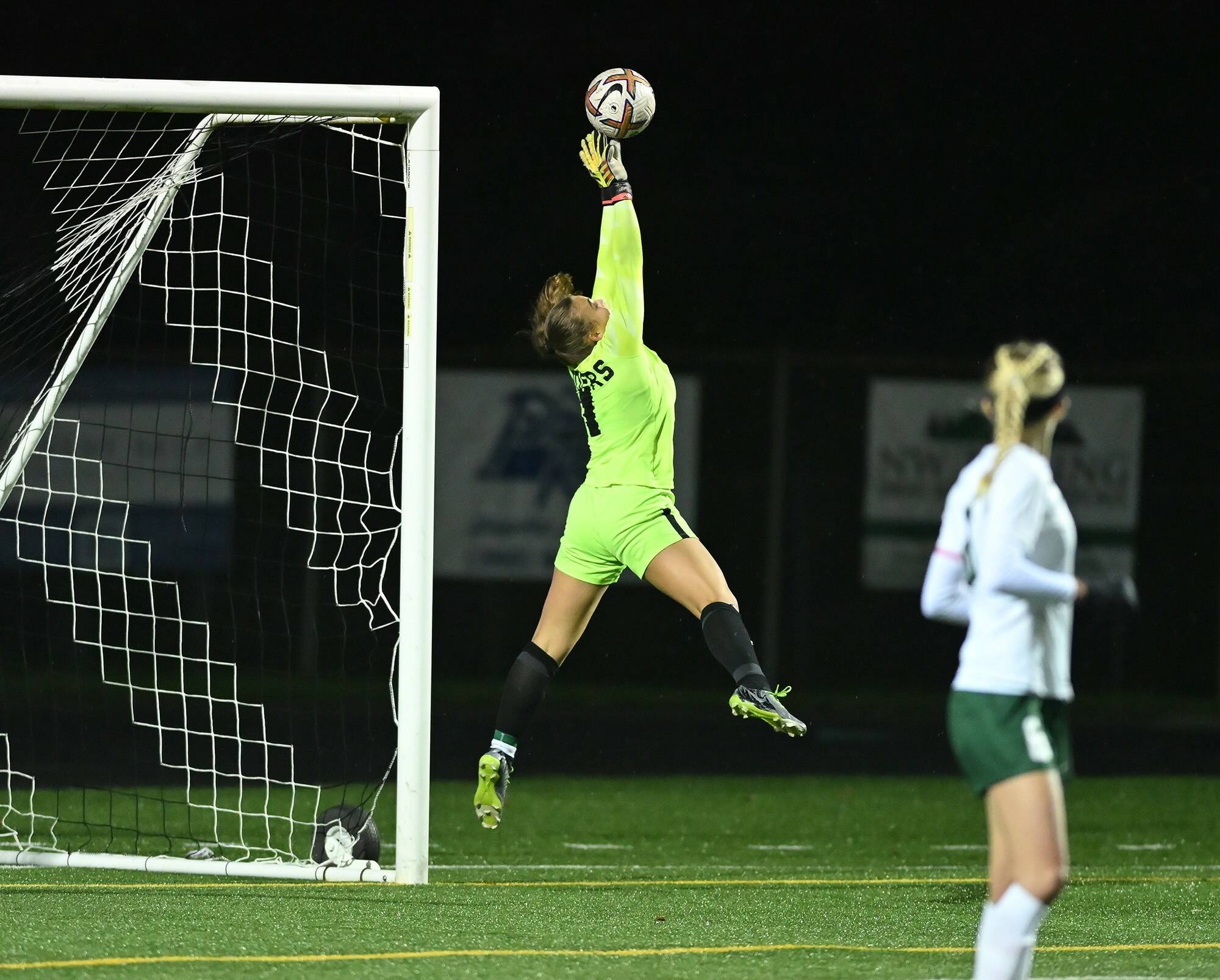 Taylor Balkom/The Columbian
Port Angeles senior Kennedy Rognlien stretches to make a save during the Roughriders' 1-0 loss to Hockinson in a Class 2A girls soccer state tournament game at Battle Ground High School. This was Rognlien's 16th and final save of the game.