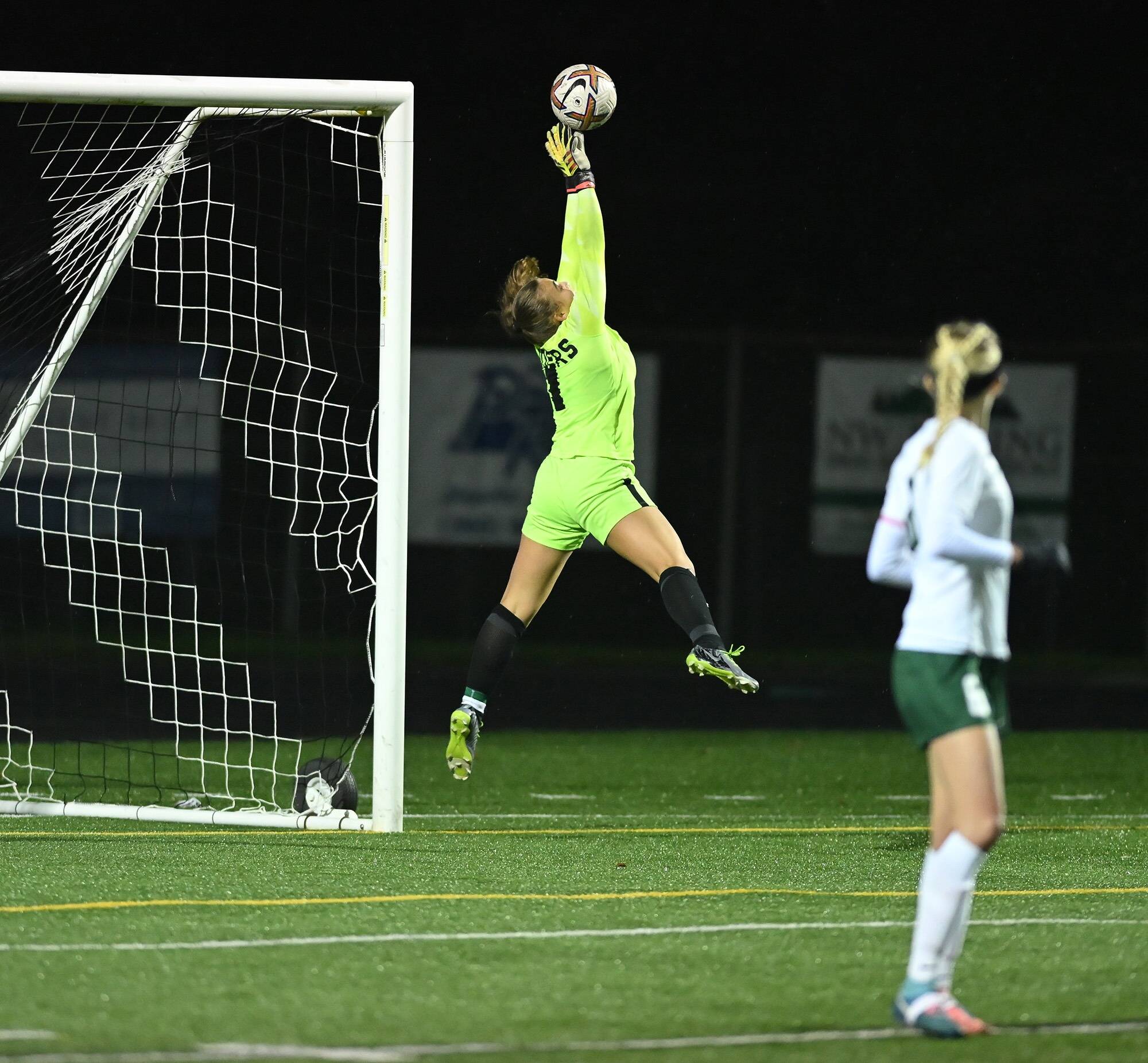 Taylor Balkom/The Columbian Port Angeles senior Kennedy Rognlien stretches to make a save during the Roughriders’ 1-0 loss to Hockinson in a Class 2A girls soccer state tournament game at Battle Ground High School. This was Rognlien’s 16th and final save of the game.