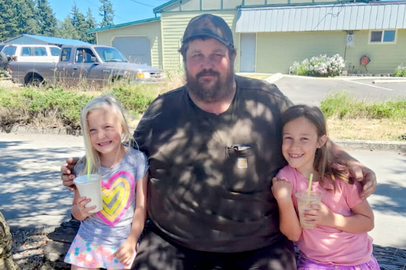 Kirky Lakenes bought milkshakes for his nieces Ava, left, and Mia Hathaway in Chimacum earlier this year.