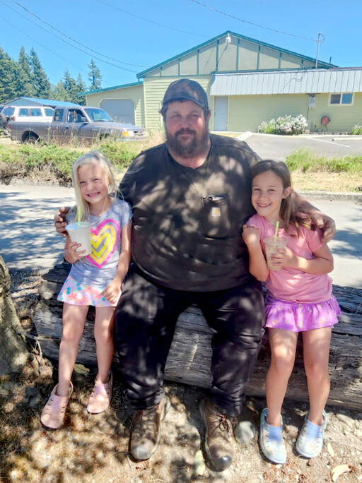 Kirky Lakenes bought milkshakes for his nieces Ava, left, and Mia Hathaway in Chimacum earlier this year.