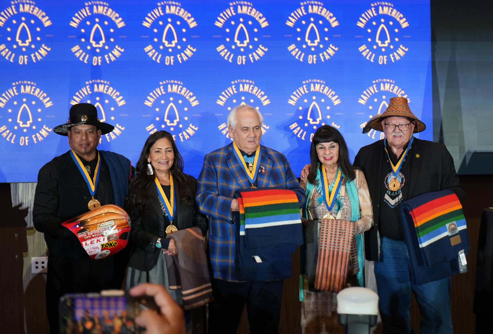 Inductees into the 2025 National Native American Hall of Fame include, from left, Ross Anderson, Deb Haaland, Dwight Birdwell, Lynn Valbuena and W. Ron Allen. Not pictured is Notah Begay III, who was unable to attend the Nov. 1 induction ceremony in Oklahoma City. (Mike Dashiell/Jamestown S’Klallam Tribe)