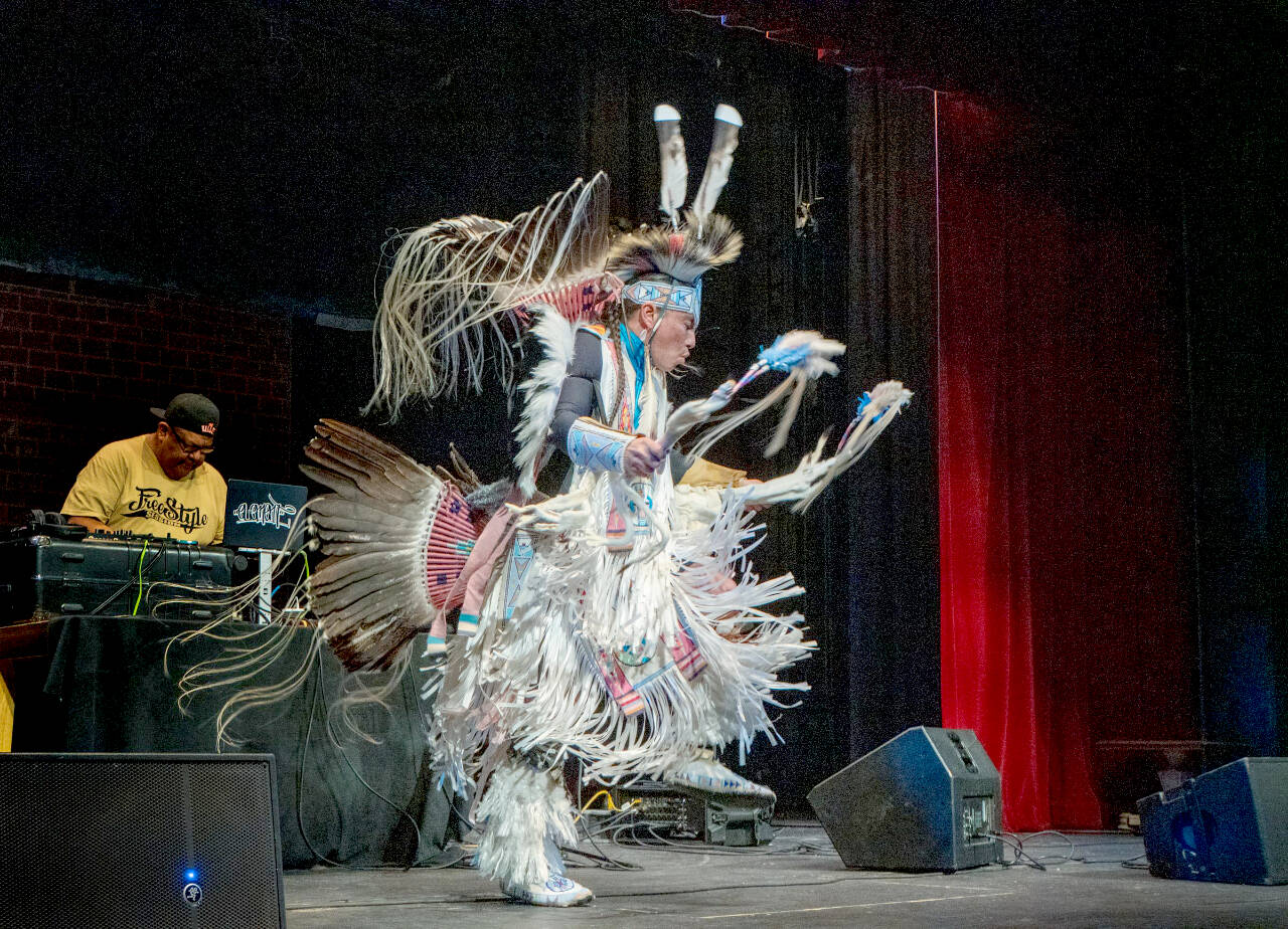 Steve Mullensky/For Peninsula Daily News
Supaman performs a “Men’s War Dance” to a full house on Thursday at the Port Townsend High School auditorium. Supaman, whose real name is Christian Parrish Takes the Gun, is an Apsáalooke rapper and fancy war dancer who grew up in Crow Agency, Mont.