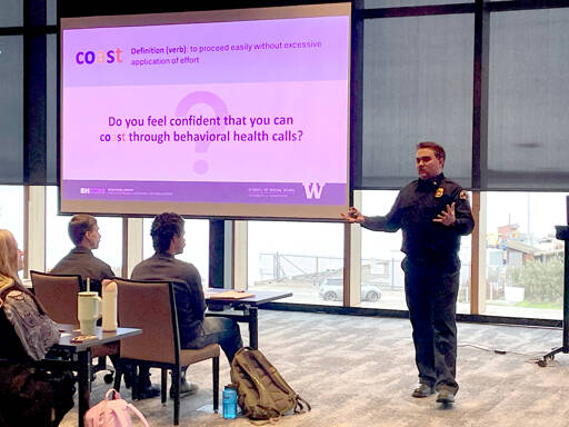 Tyler Gage, Port Angeles Fire Department EMS division chief, leads a training for first responders that equips them with skills for handling mental health and substance abuse calls. Called “COAST,” the program was developed by the Behavioral Health Crisis Outreach Response and Education center operated by the University of Washington School of Social Work. (Paula Hunt/Peninsula Daily News)