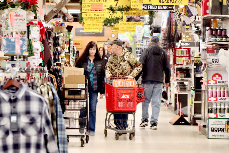 Bob and Pam Aunspach were early shoppers during Black Friday at Swain’s as Bob got a sought-after griddle in his cart. Early morning shoppers were able to peruse the aisles beginning at 8 a.m. (Dave Logan/for Peninsula Daily News)