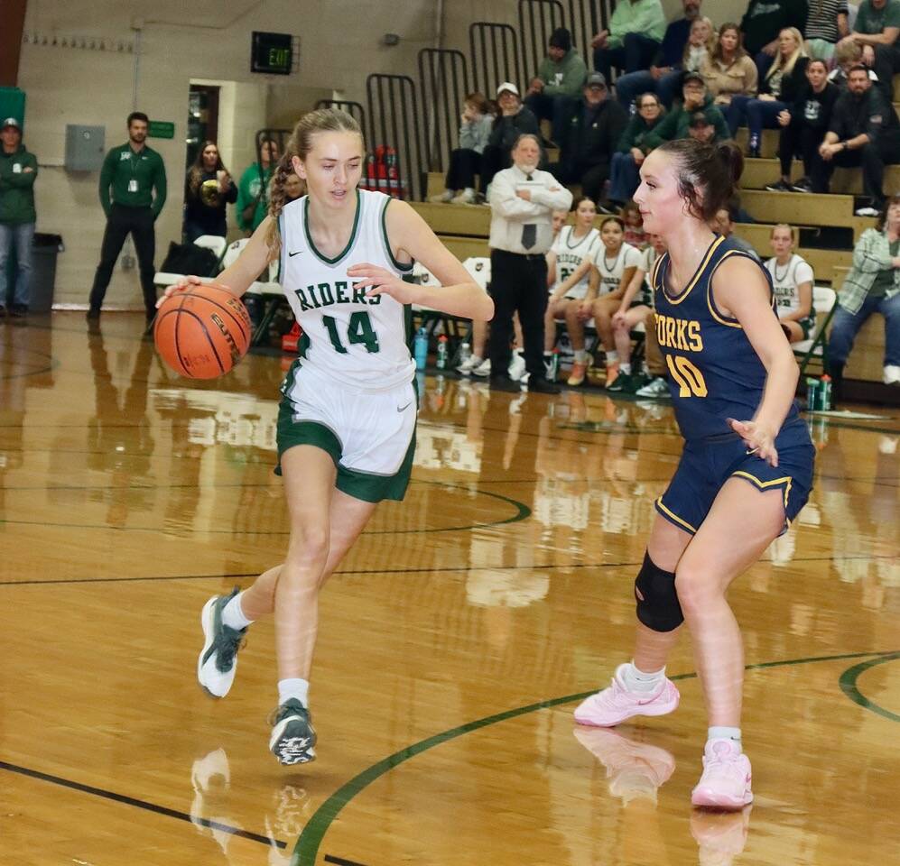 Dave Logan/for Peninsula Daily News 
Forks’ Avery Dilley defends against Port Angeles’ Storey Schmidt during the team’s season opener last week.
