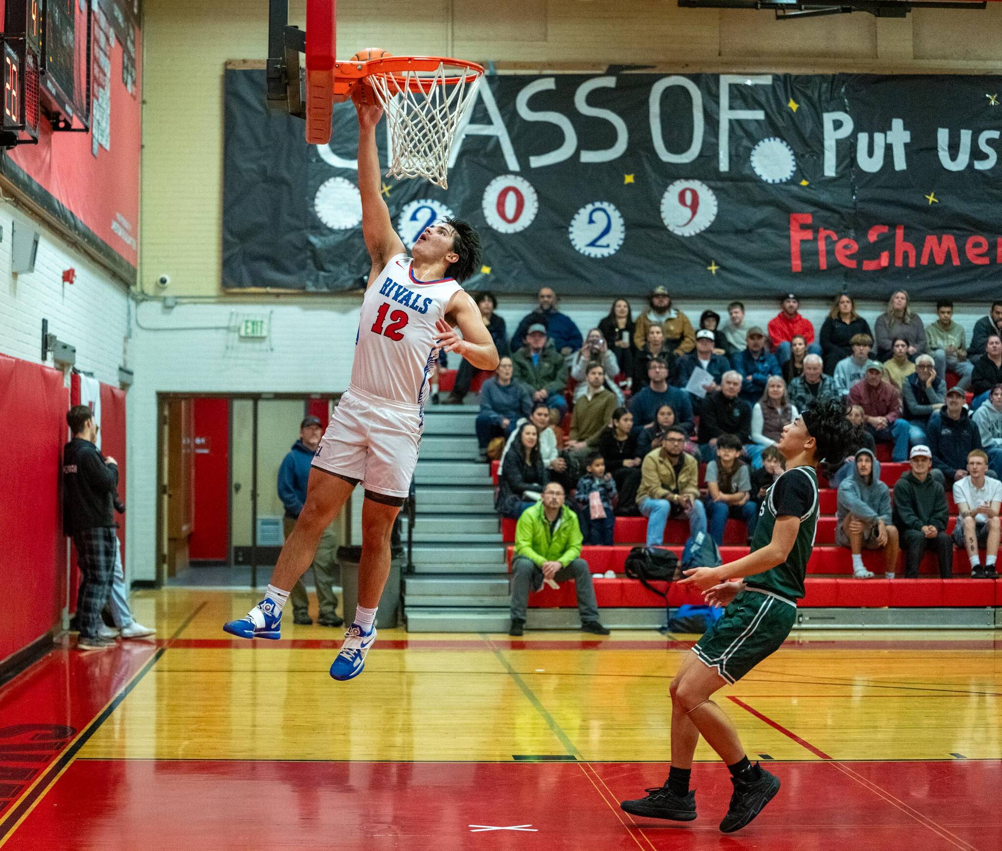 Steve Mullensky/for Peninsula Daily News 
East Jefferson’s Luke O’Hara rises for a layup during the Rivals’ 71-42 season-opening win over Nisqually League foe Charles Wright on Thursday at Bruce Blevins Gymnasium.