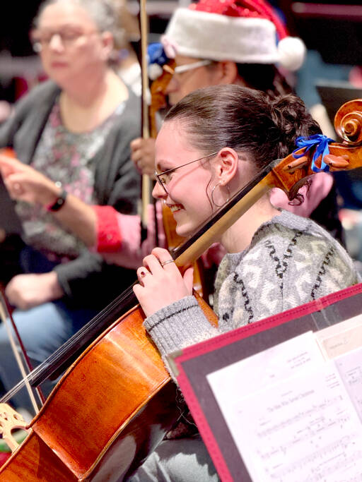 Cellist Joanna Minnoch, shown in rehearsal, is among the 75 Port Angeles Symphony musicians preparing for Saturday’s Holiday Concert. (Diane Urbani de la Paz/For Peninsula Daily News)