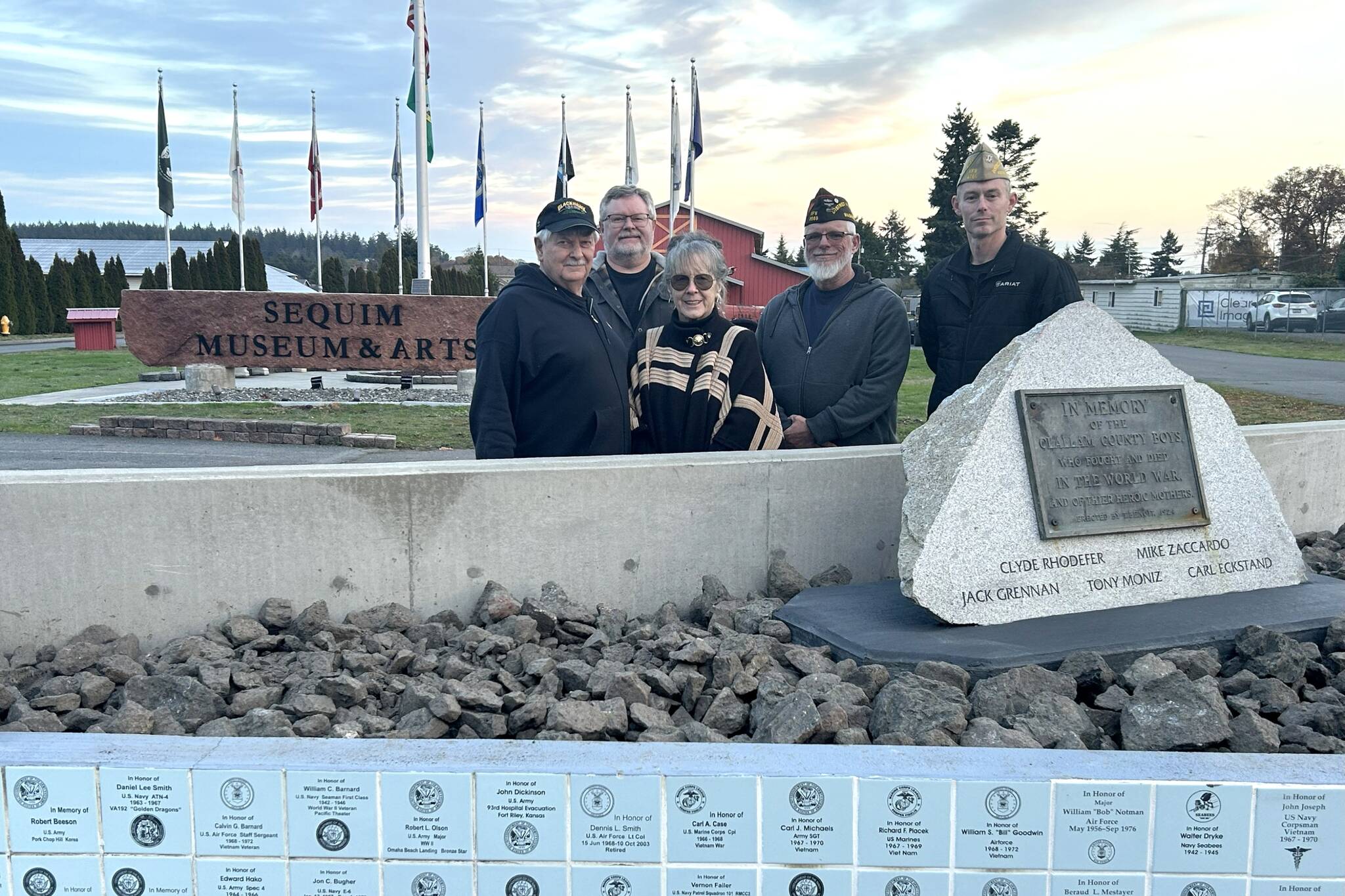 Sequim Museum volunteers Bob Stipe, Scott Stipe and executive director Judy Reandeau Stipe stand with Dan Bujok, VFW district commander, and Ken Bearly, Carlsborg 4760 post commander, at the museum’s Veterans Monument. It’s recently been refurbished and organizers welcome past and present veterans and their family members to apply for a tile to be placed on the east side of the wall. (Matthew Nash/Olympic Peninsula News Group)