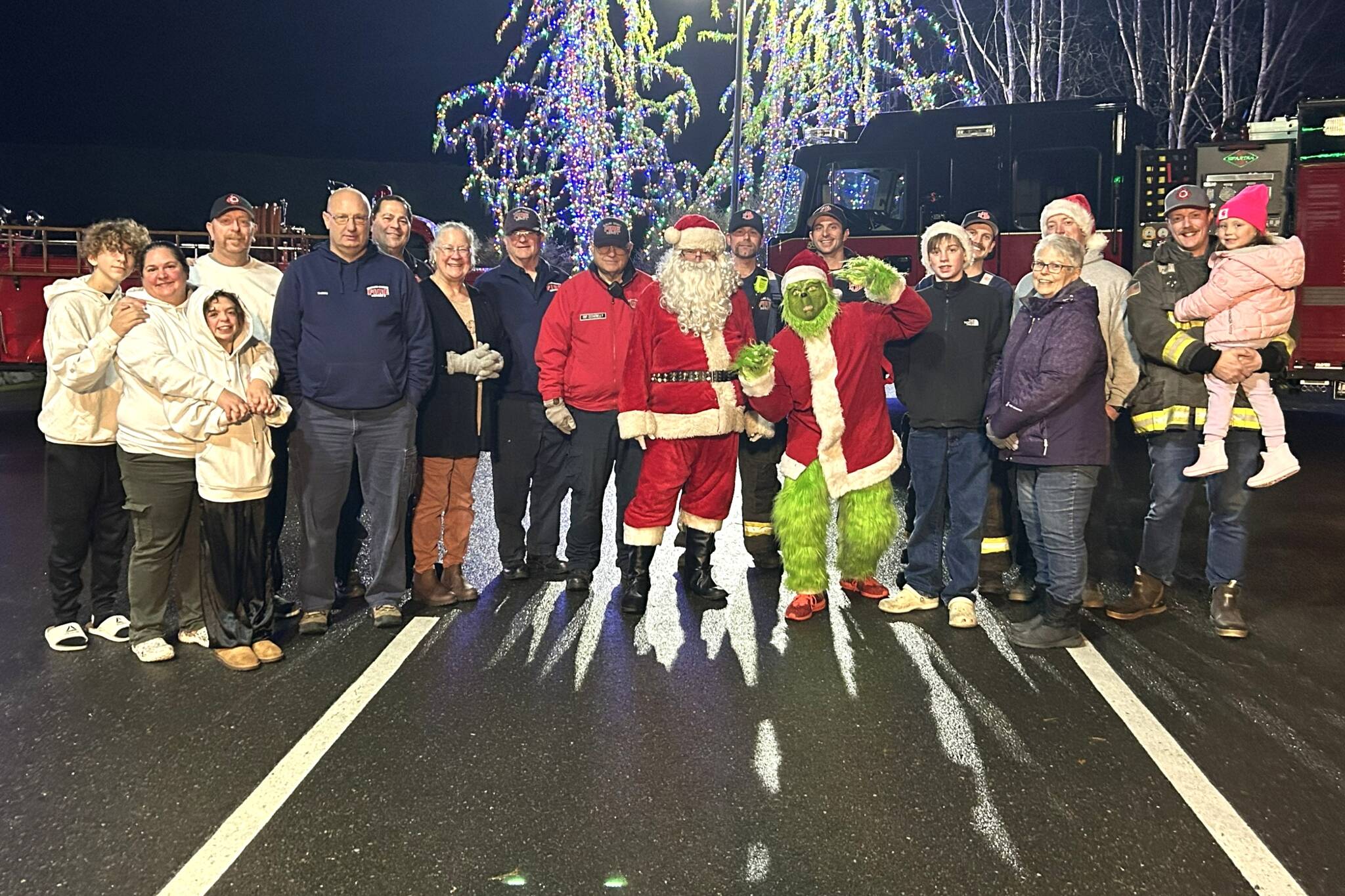 Santa Claus, the Grinch and career and volunteers with Clallam County Fire District 3, IAFF Local 2933 and the Community Emergency Response Team (CERT) will accept food and toy donations this week as part of Santa’s Toy and Food Fire Brigade in Sequim. The food and toy drive will end on Friday at Sequim Walmart with donations accepted from 9 a.m. to 9 p.m., and Santa arriving to hand out candy canes and take photos from 5 p.m. to 8 p.m. (Matthew Nash/Olympic Peninsula News Group)