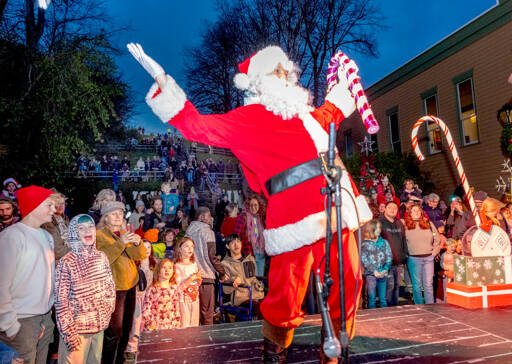 Santa greets well wishers who showed up at Haller Fountain in Port Townsend on Saturday to witness the lighting of the community Christmas tree. About four hundred fans of all ages turned out for the annual event. (Steve Mullensky/for Peninsula Daily News)