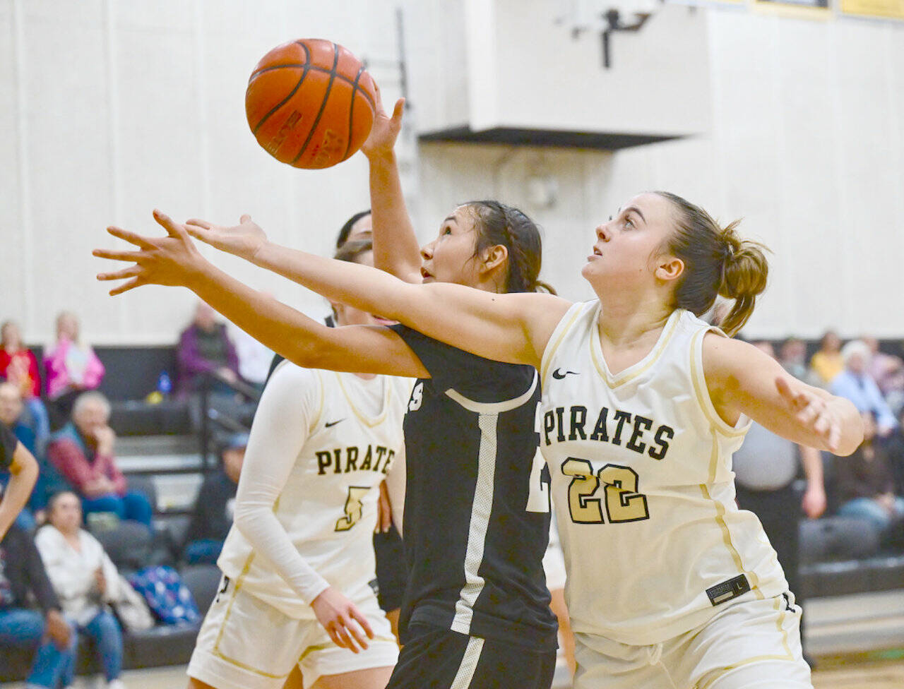Peninsula College’s Makena Patrick battles for a rebound against Tacoma on Sunday at Peninsula College. The Pirates beat Tacoma 80-48 to complete a three-game sweep in the Pirates Classic as the women improved their record to 4-2. Patrick contributed 10 points and nine rebounds in Sunday’s victory. (Jay Cline/Peninsula College)