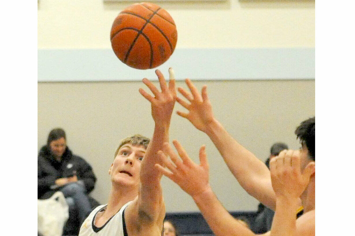 Ty Rowley (20) is the biggest returning player for the Forks Spartans this year. Rowley scored 36 points and pulled down 18 rebounds in a win this week against Hoquiam and is part of a big squad for the Spartans. (Lonnie Archibald/for Peninsula Daily News)