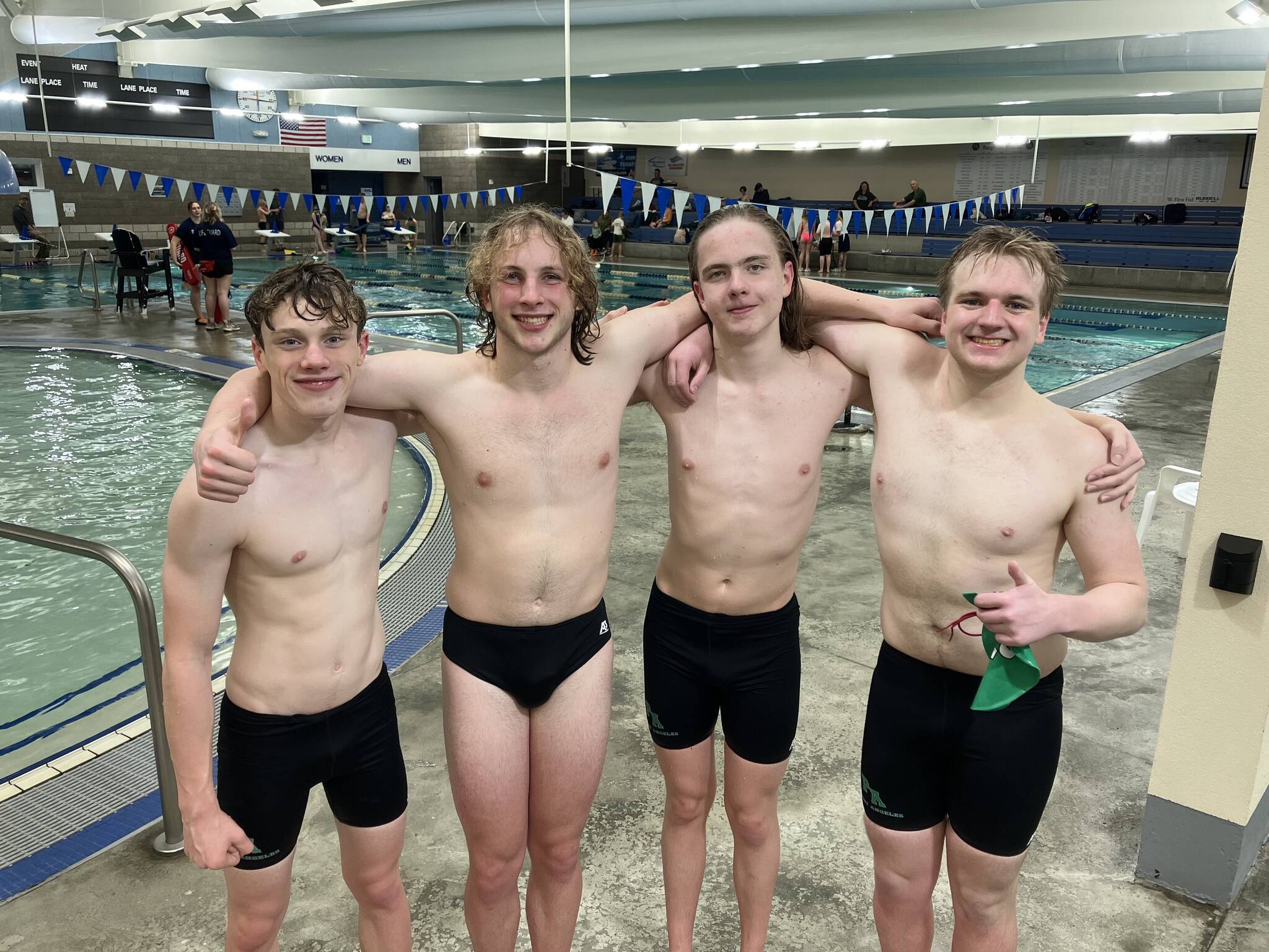 Port Angeles’ 400-yard free relay team achieved a state-qualifying time, improving their previous best by two seconds during the Riders’ swim meet against defending state-champion Bainbridge at Shore Aquatic Center on Wednesday in Port Angeles. Swimmers are, from left, Patrick Ross, Miles Van Denburg, Adam Kaminski and Thomas Jones.
