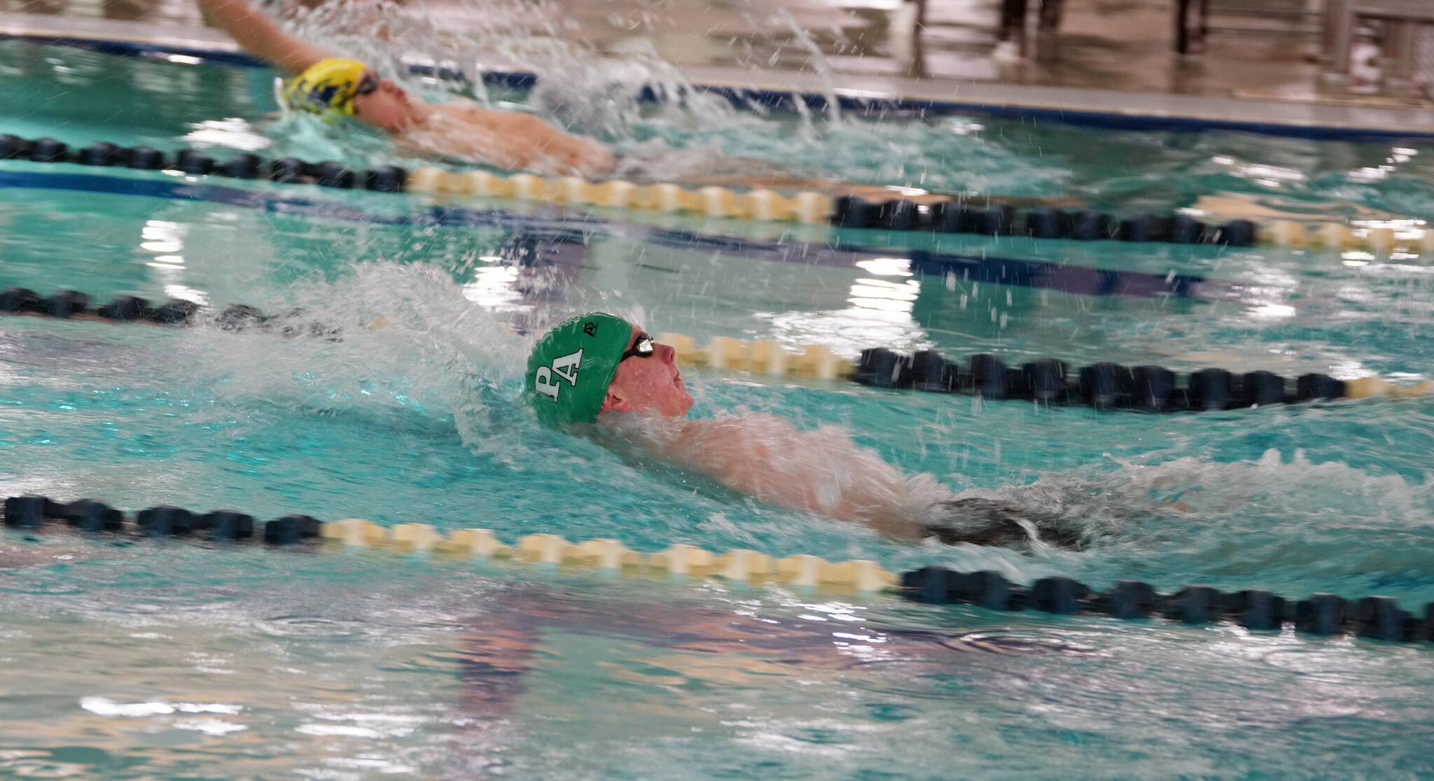 Linda Adams
Port Angeles’ Adam Kaminski competes in the 100-yard backstroke during a swim meet with defending state-champion Bainbridge at Shore Aquatic Center in Port Angeles.