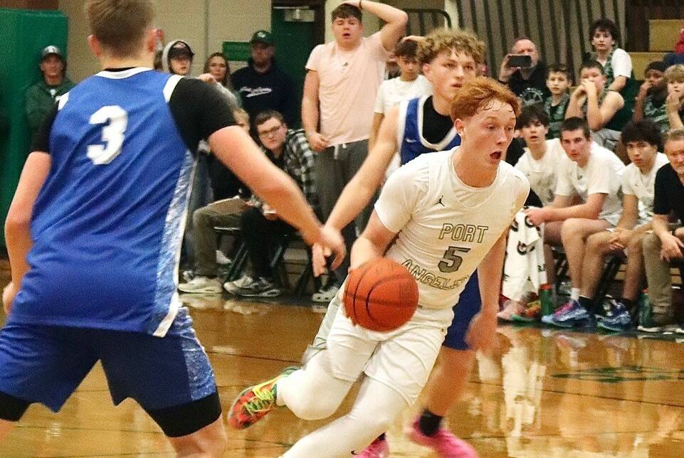 Daniel Benoit drives the ball up the court against Elma in Port Angeles' first home game of the year Saturday. The Riders overcame an 18-0 Elma run to win in the fourth quarter 56-50. (Dave Logan/for Peninsula Daily News)