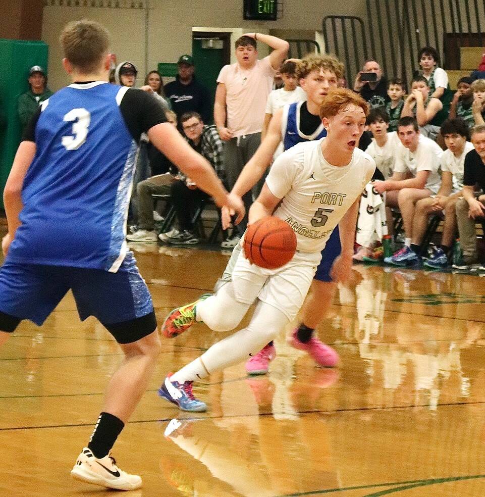 Daniel Benoit drives the ball up the court against Elma in Port Angeles’ first home game of the year Saturday. The Riders overcame an 18-0 Elma run to win in the fourth quarter 56-50. (Dave Logan/for Peninsula Daily News)