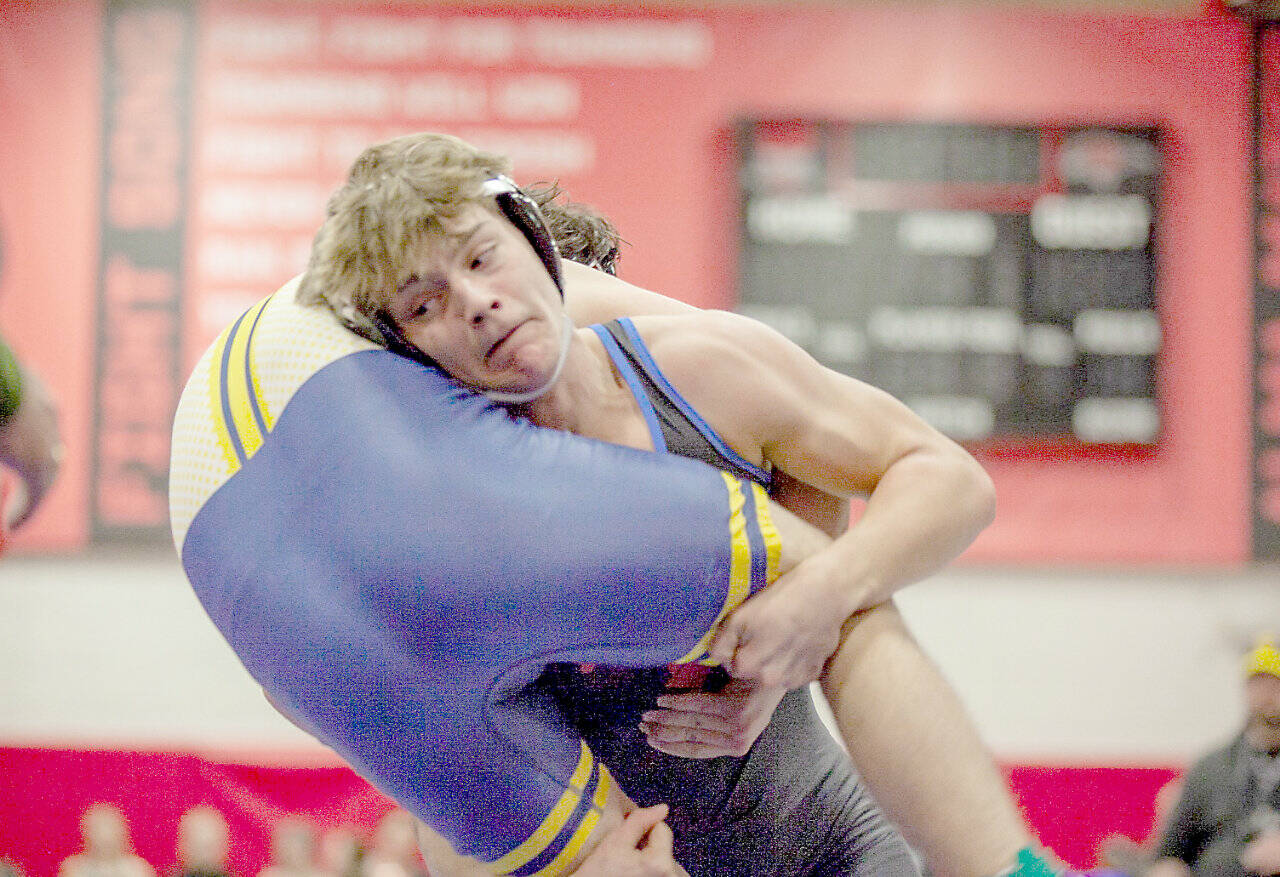 East Jefferson’s Jackson Dupuy performs a takedown of a Forks wrestler at East Jefferson’s team duals held this weekend. (Ava Fletcher)