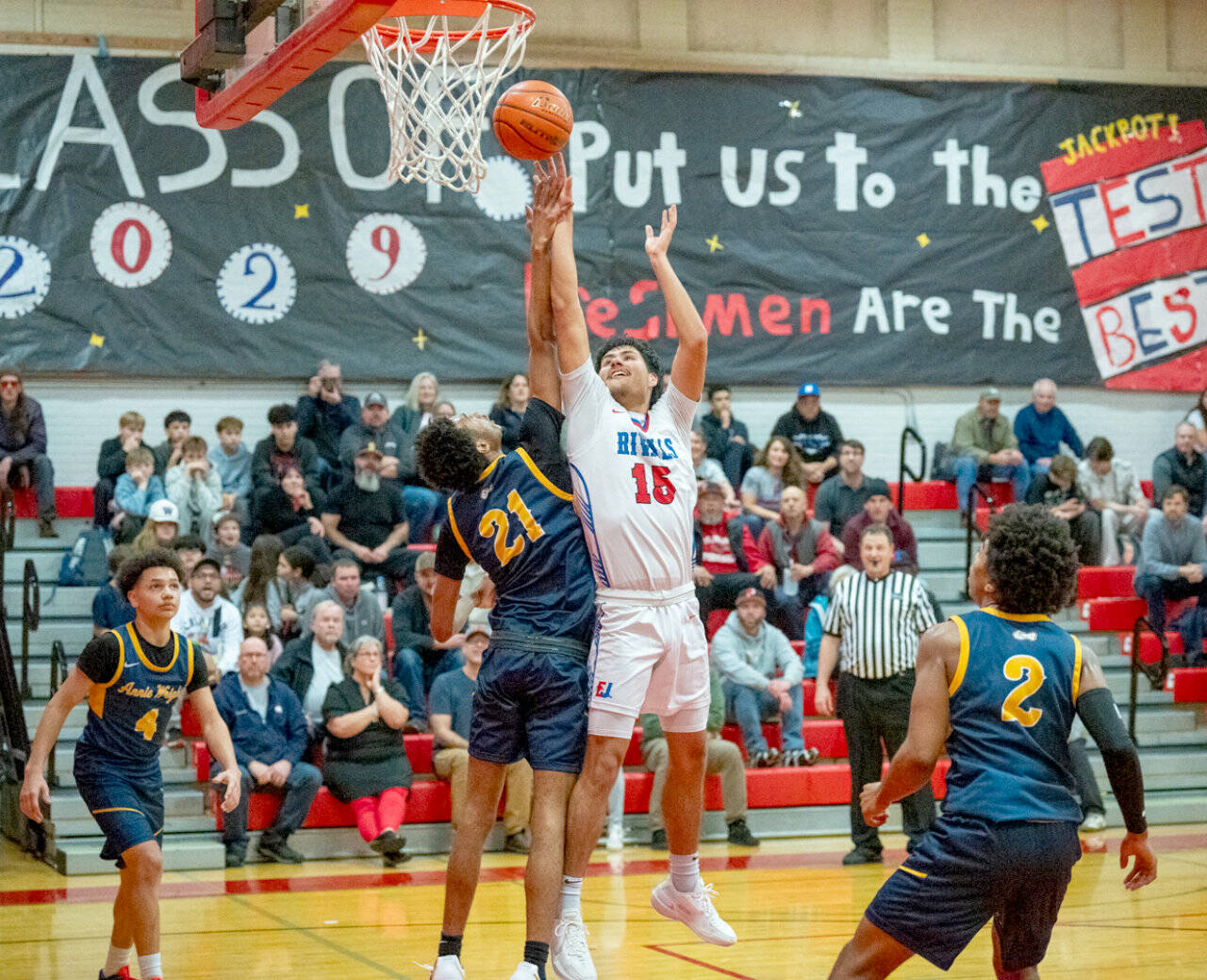 East Jefferson’s Dillon Page-Castillo battle for a rebound against defending state champion Annie Wright in a game Tuesday in Port Townsend. Annie Wright won 89-44. (Steve Mullensky/for Peninsula Daily News)