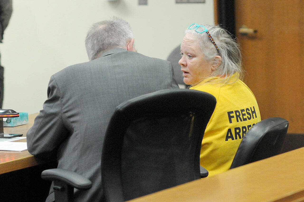 Tina Marie Alcorn, right, talks with attorney John Hayden during Alcorn’s first appearance on June 10, 2025, in Clallam County Superior Court after extradition from Arkansas in connection with the 2016 homicide of George Cecil David in Port Angeles. (Keith Thorpe/Peninsula Daily News)